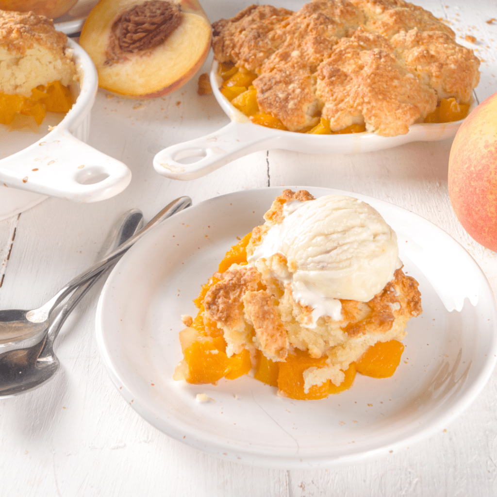 Plate of peach cobbler with a scoop of ice cream on top is one of the popular cobblers