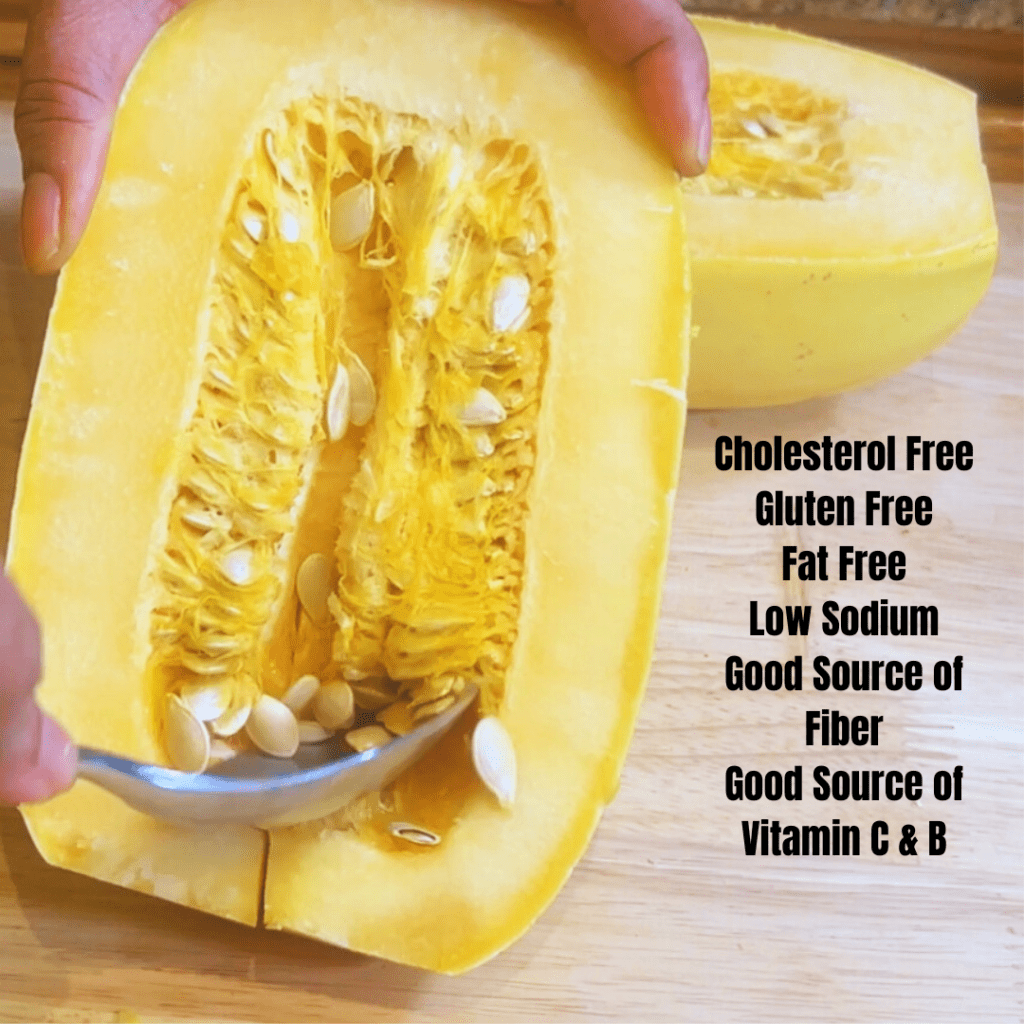 An open spaghetti squash with the seeds exposed